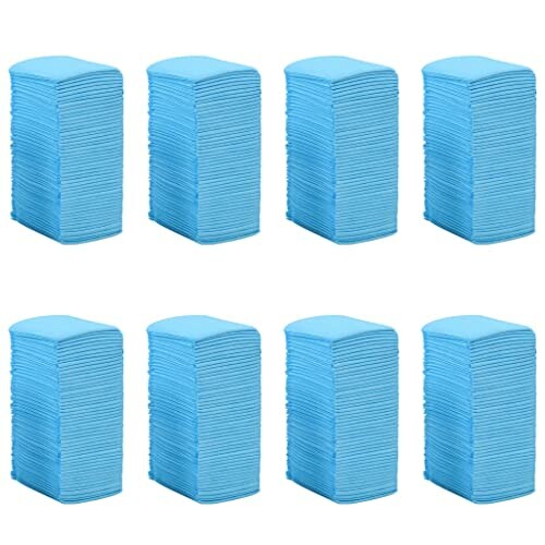 Eight stacks of blue towels arranged in two rows.