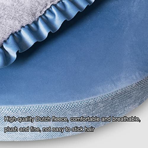 Close-up of blue fleece fabric with ruffled edge, highlighting plush texture.